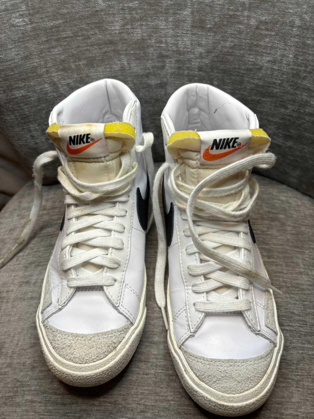 Nike White High-Top Sneakers with Black Swoosh
